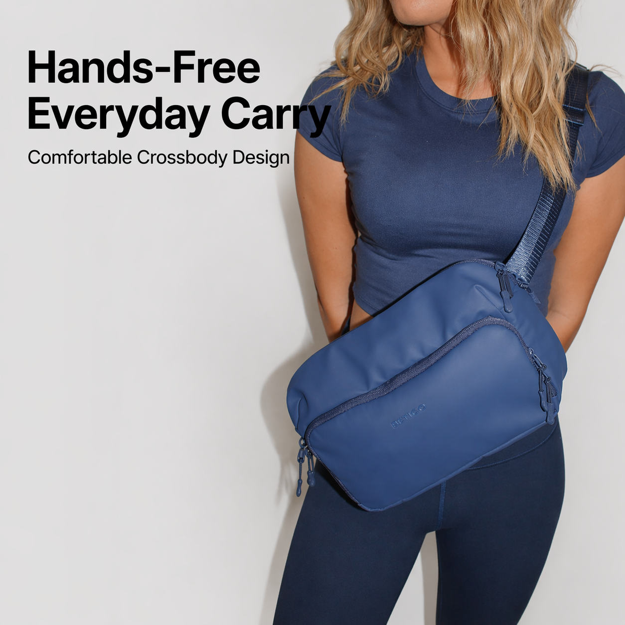 Woman wearing blue Betico crossbody organiser bag for active lifestyles, wellness routines and comfortable everyday carrying
