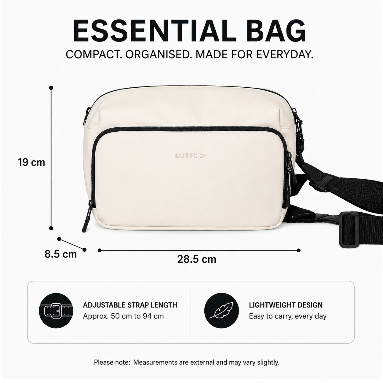 Dimension graphic of the Betico Essential Bag in cream and black showing 28.5 cm width, 19 cm height, 8.5 cm depth and an adjustable strap length of approximately 50 cm to 94 cm