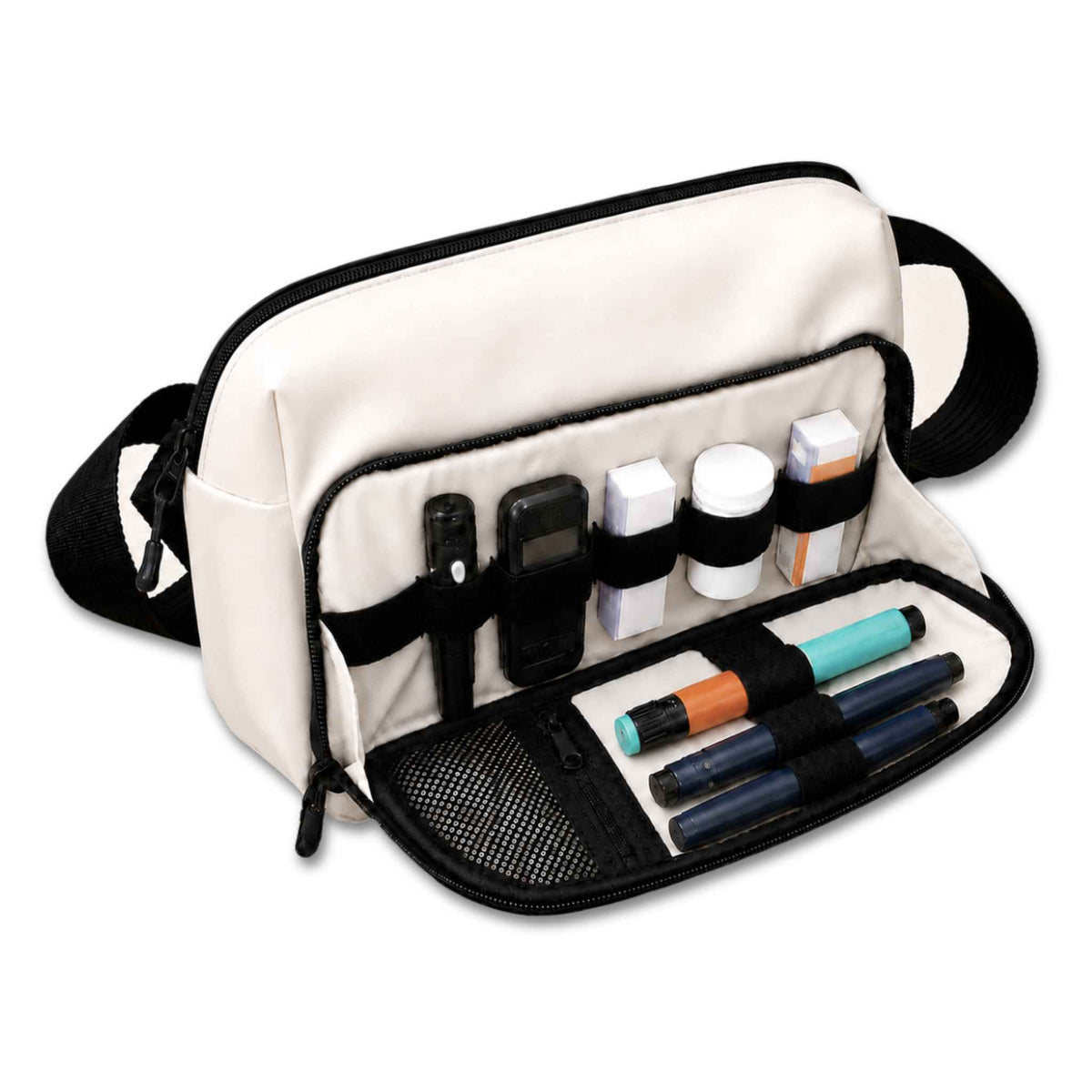 Cream and black Betico Essential Diabetes Bag with the front organiser open, showing elasticated loops, a mesh pocket and a zip pocket holding diabetes supplies.