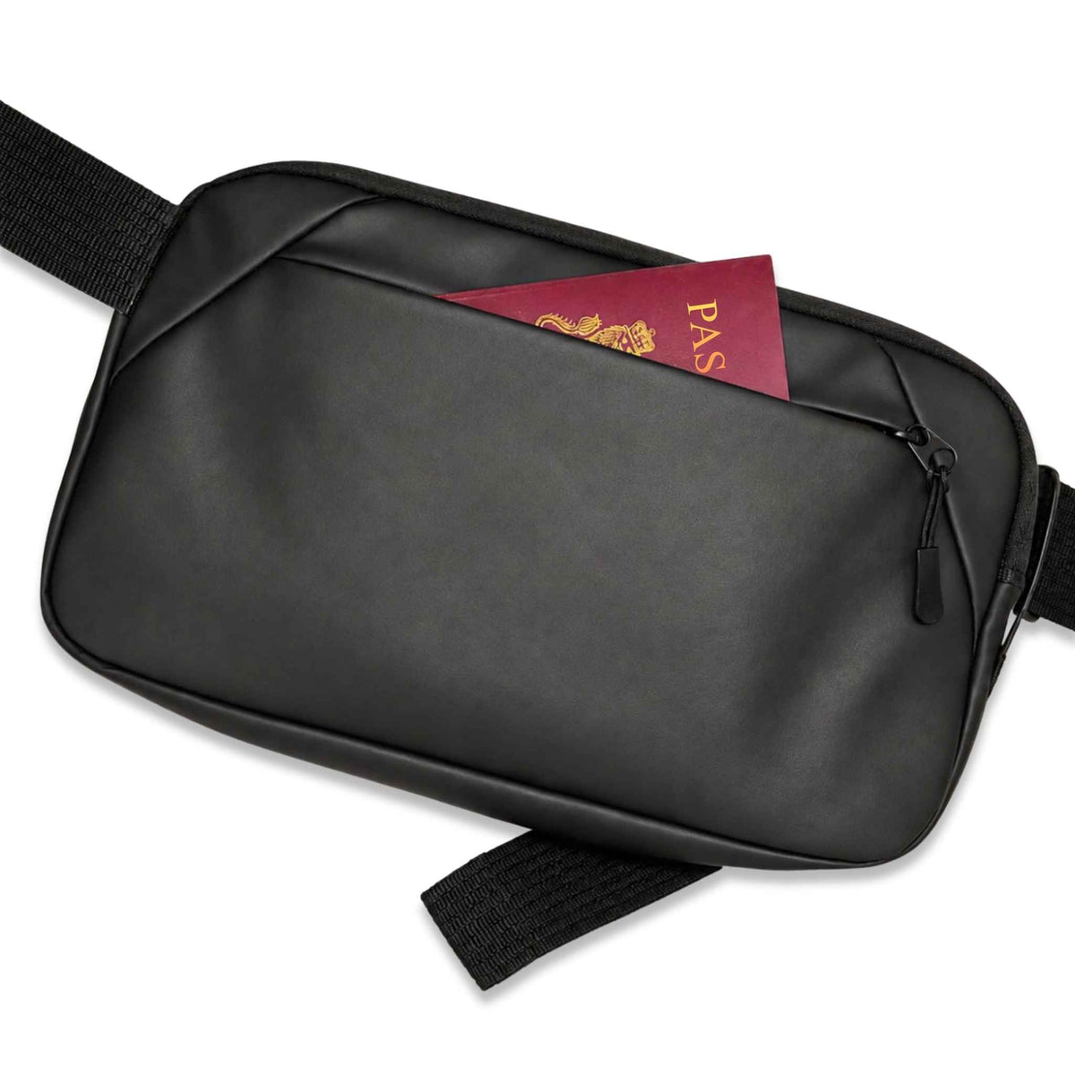 A black crossbody bag with a zippered back pocket containing a red passport, shown on a clean white background.