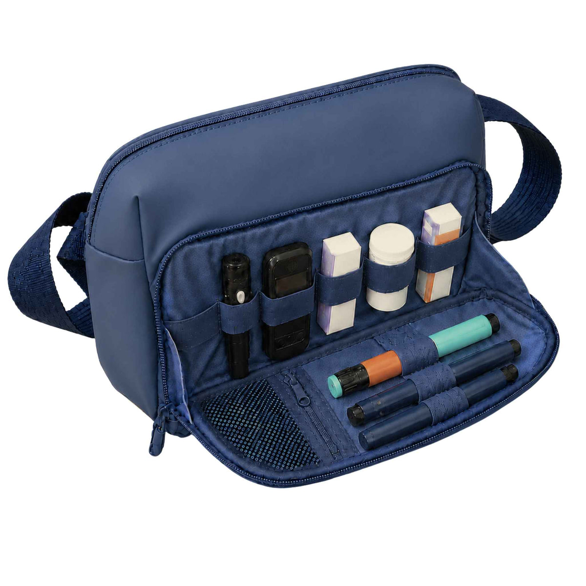 Blue Betico Essential Diabetes Bag with the front organiser open, showing elasticated loops, a mesh pocket and a secure zip pocket holding diabetes supplies.